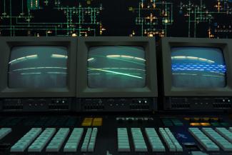 Three old crt monitors display a line. by Igor Saikin courtesy of Unsplash.
