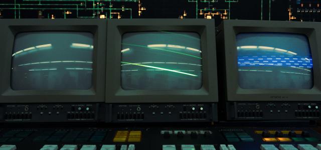 Three old crt monitors display a line. by Igor Saikin courtesy of Unsplash.